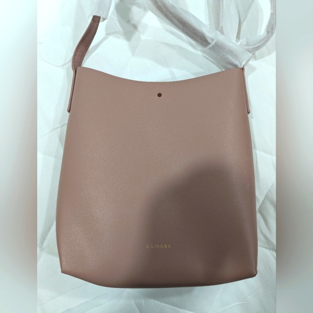 Samara over the shoulder or cross body purse. Dirty pink in color. NWOT